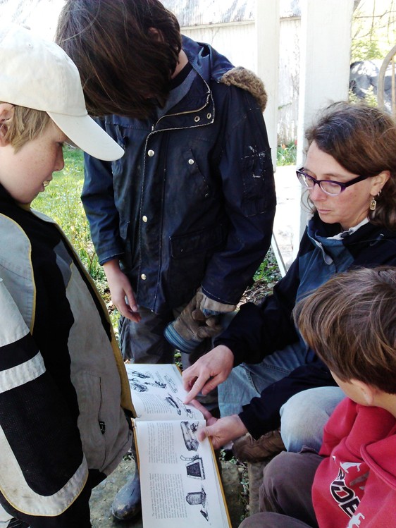 Reading and quizzing each other from a book called Moving Heavy Things