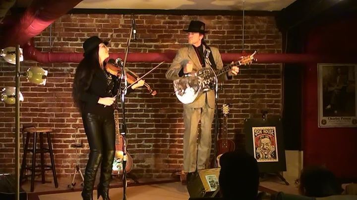 JJ plays a resonator slide guitar in the style used by Delta bluesmen of the 1930s. Irina's violin accompaniment is haunting.