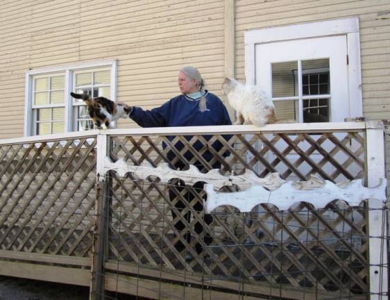 Anna Welch with friends at the entrance of the Carthage Mill. The historic Tweedy Lumber Mill is now the site of a sustainable ag business incubator.