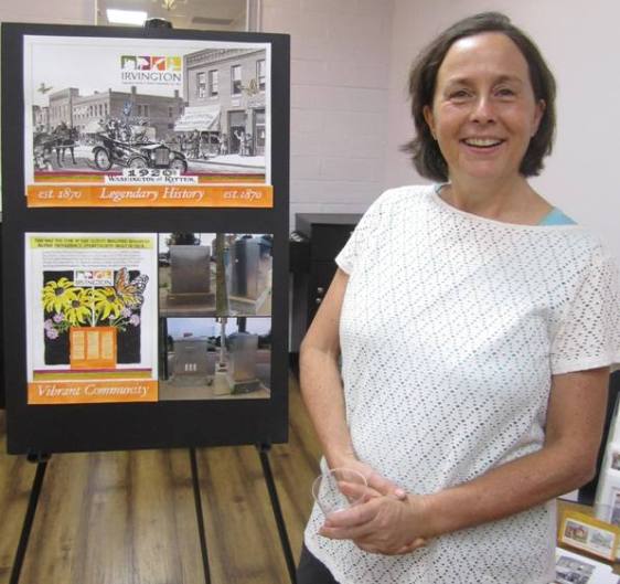 Laura with a representation of her design for the signal box at the corner of Washington and Ritter.